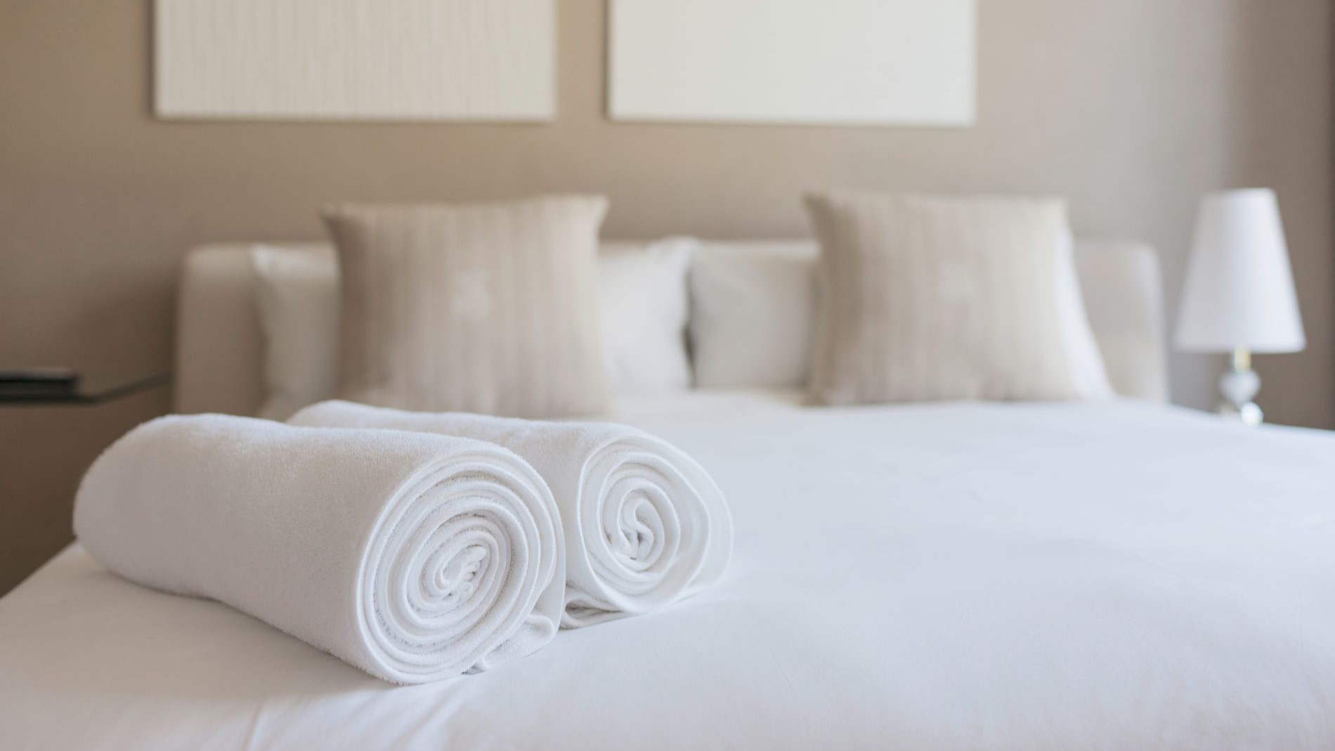 Hotel bed with towels