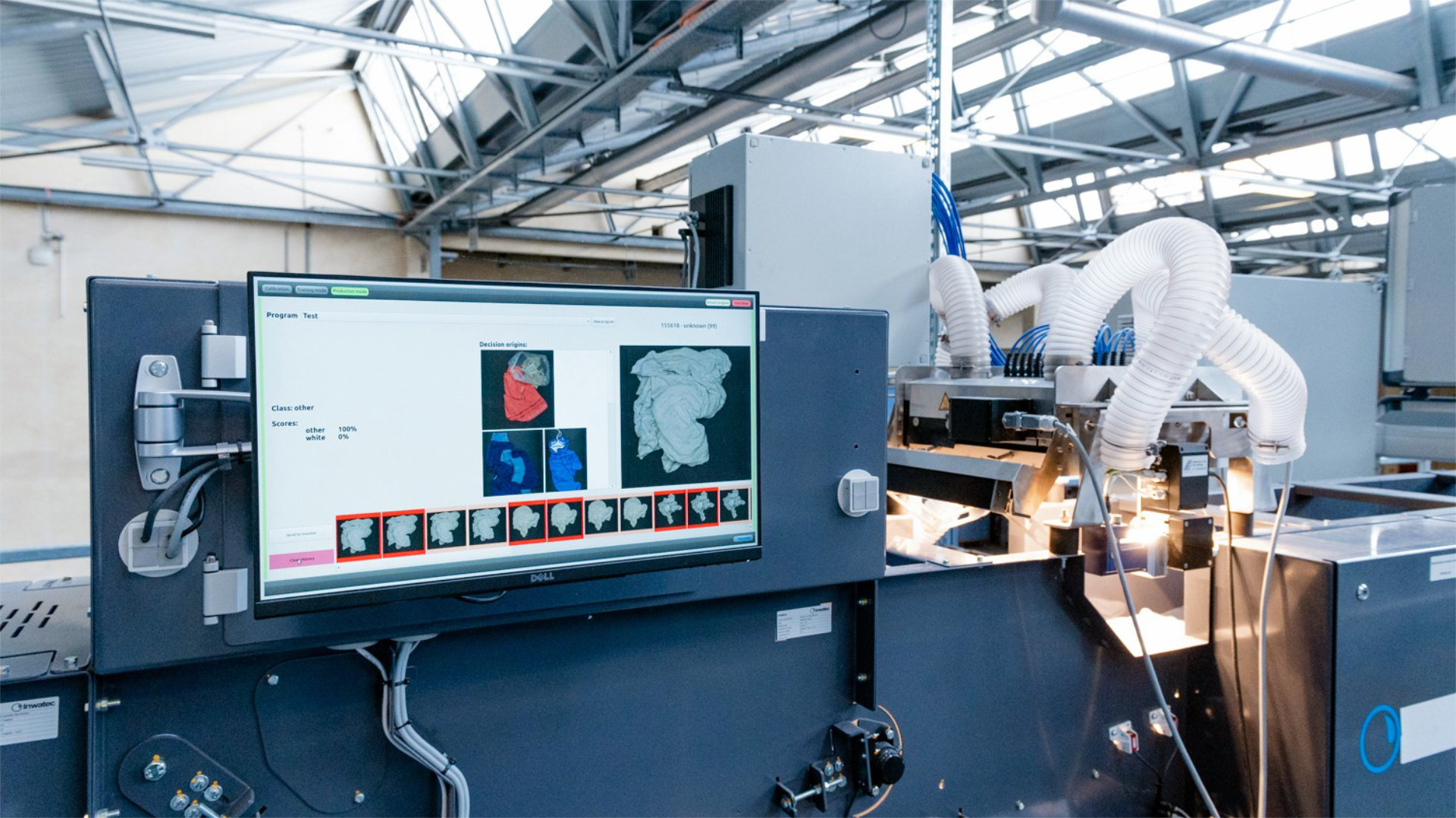 Automatic sorting machine for textiles