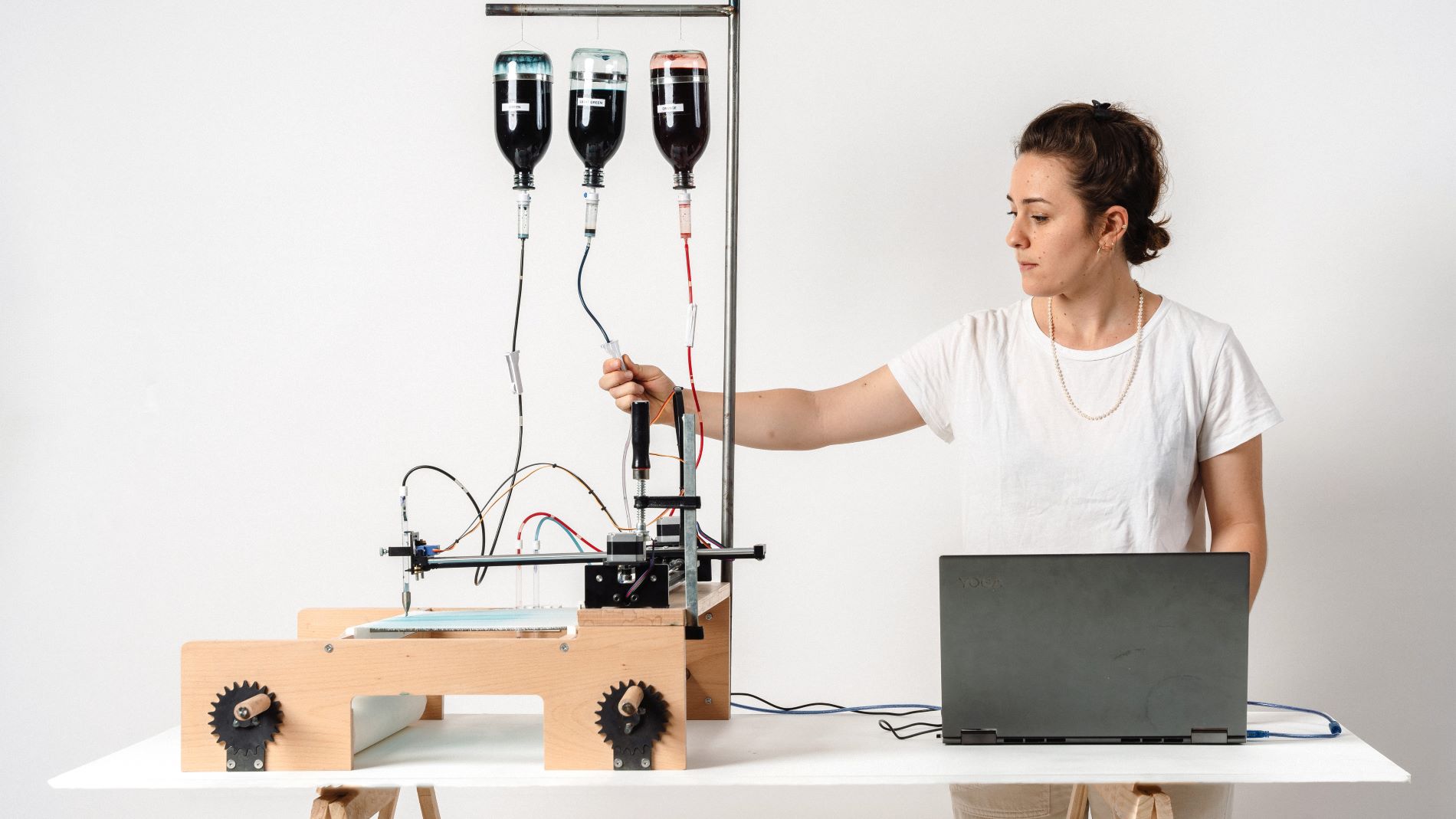 Woman next to the pen plotter