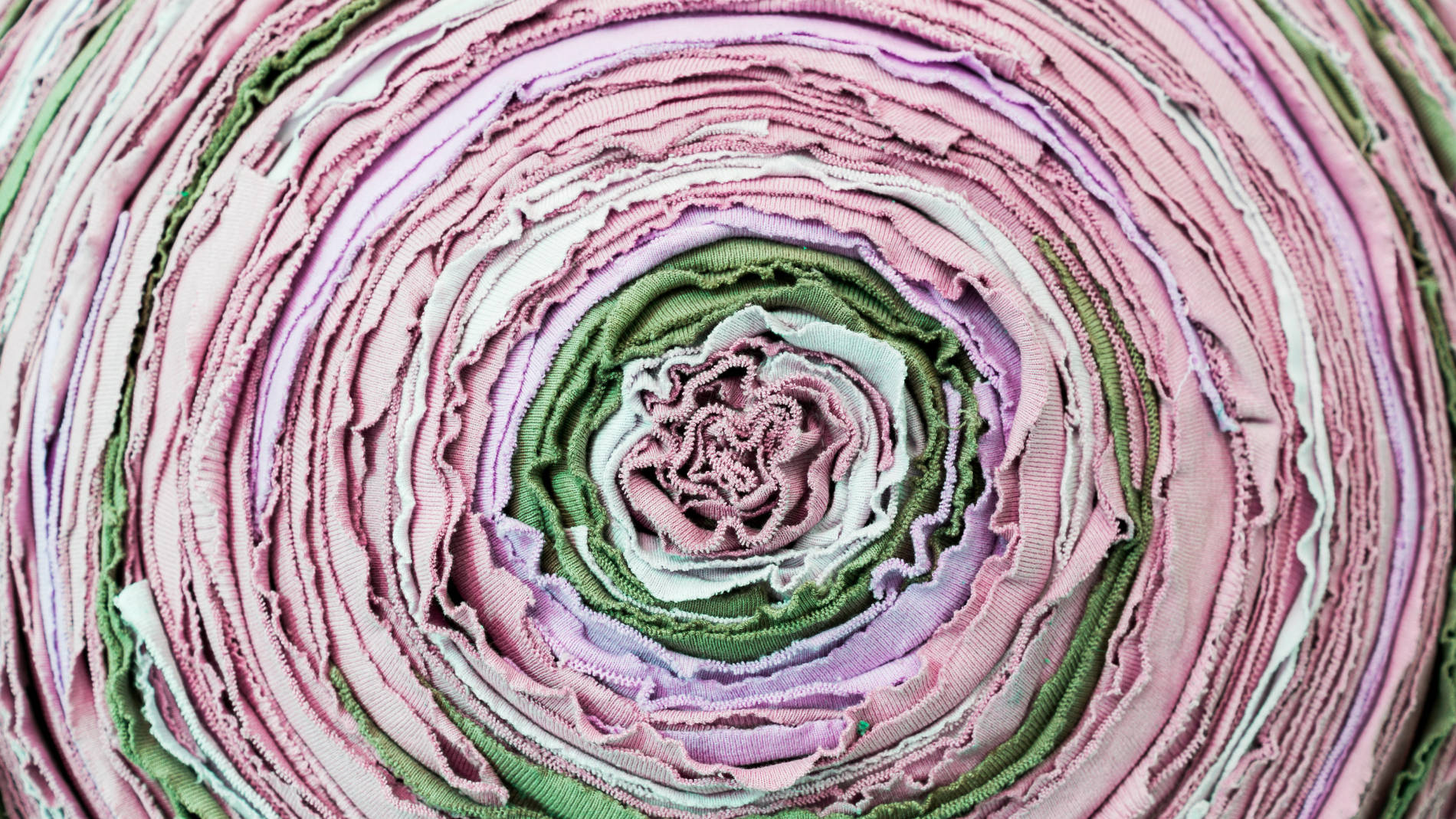 Rolled fabric layers forming colourful textured pattern