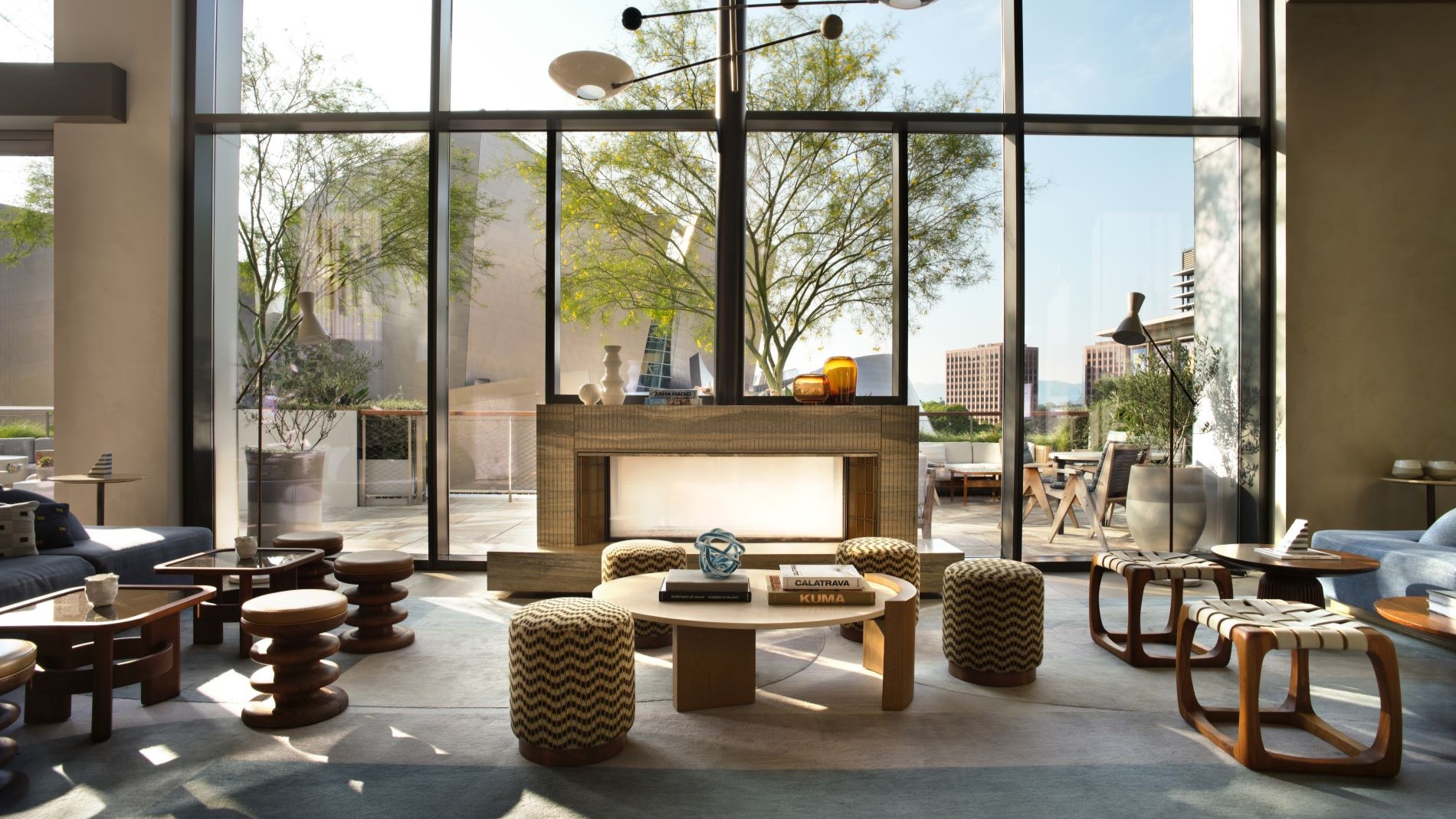 Modern loft with tall windows and elegant decor.