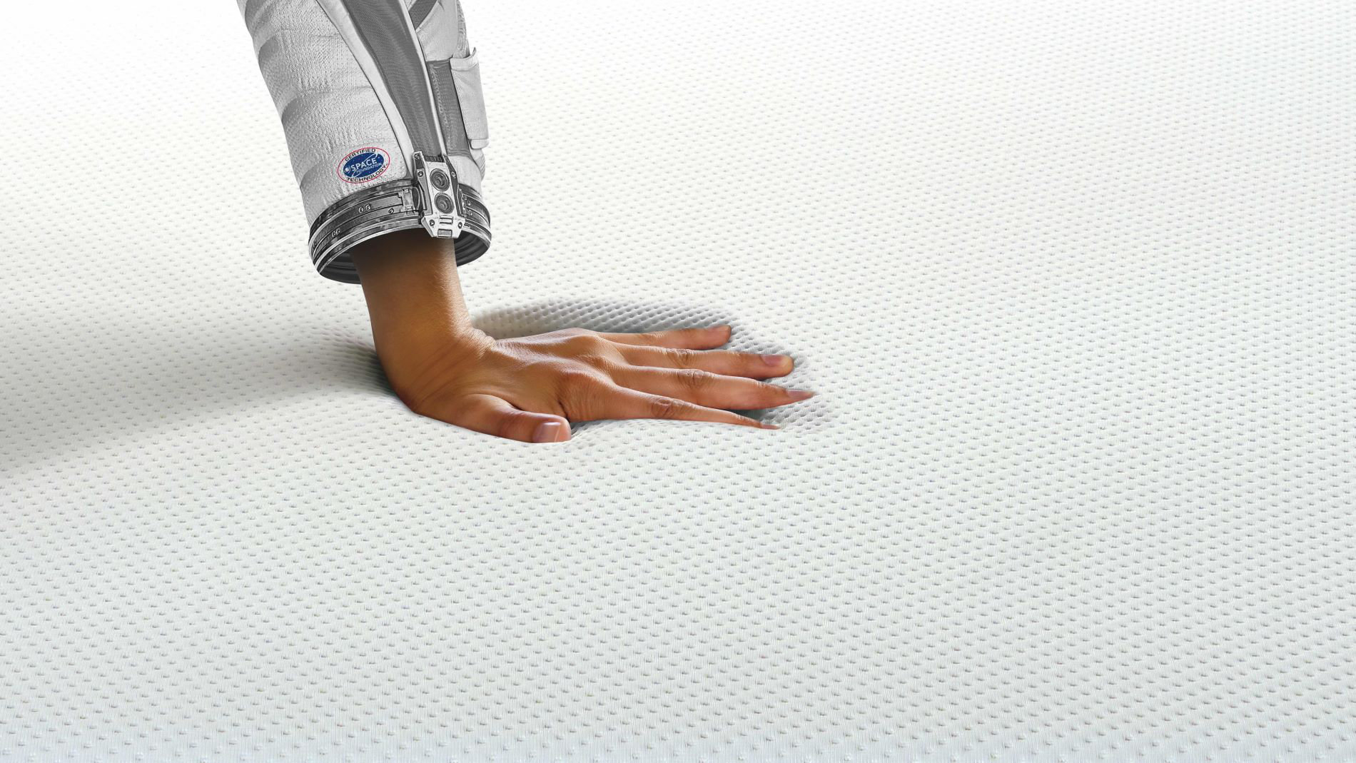 Hand pressing into textile cushioning material