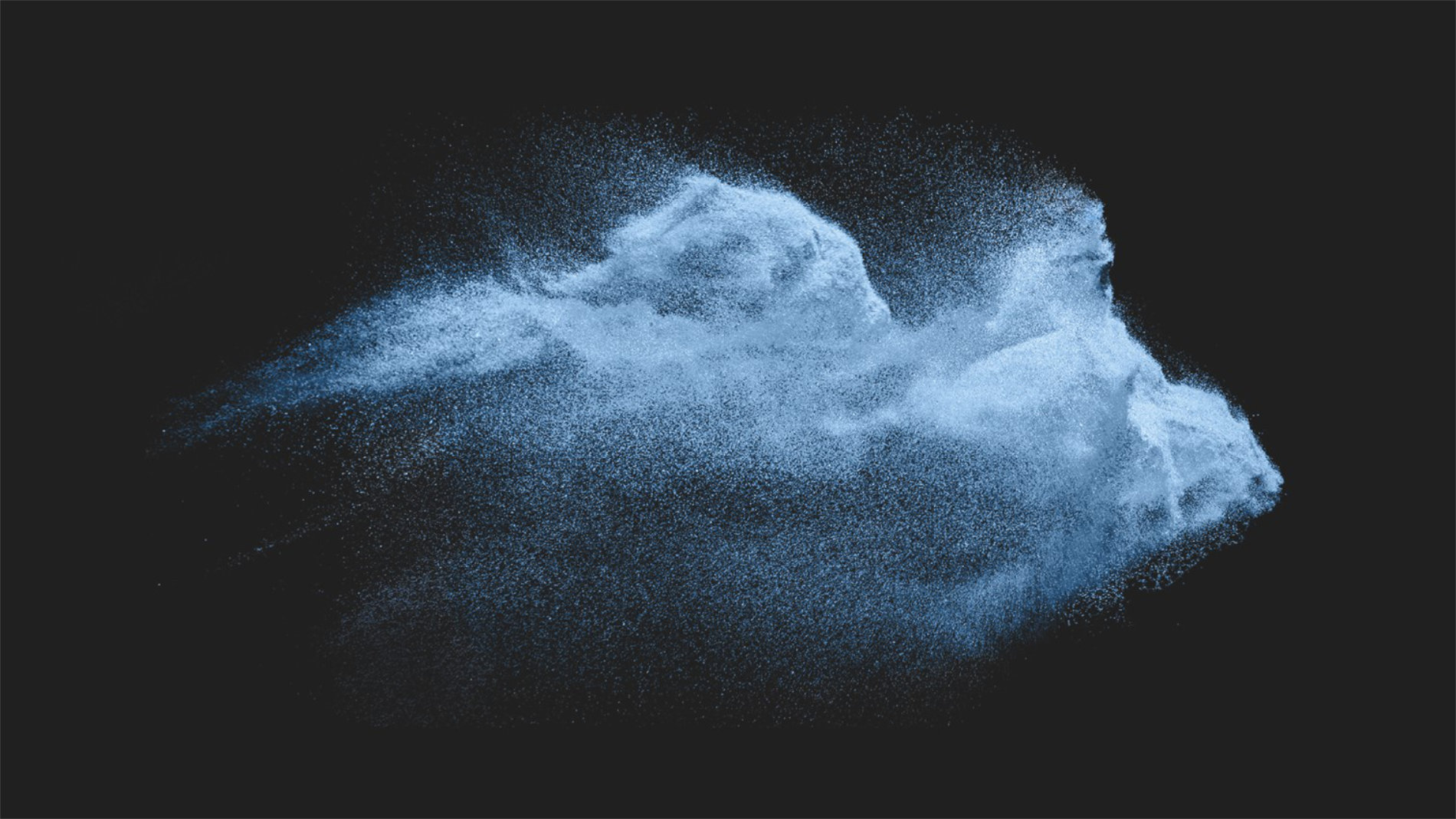 Blue textile fibres against black background