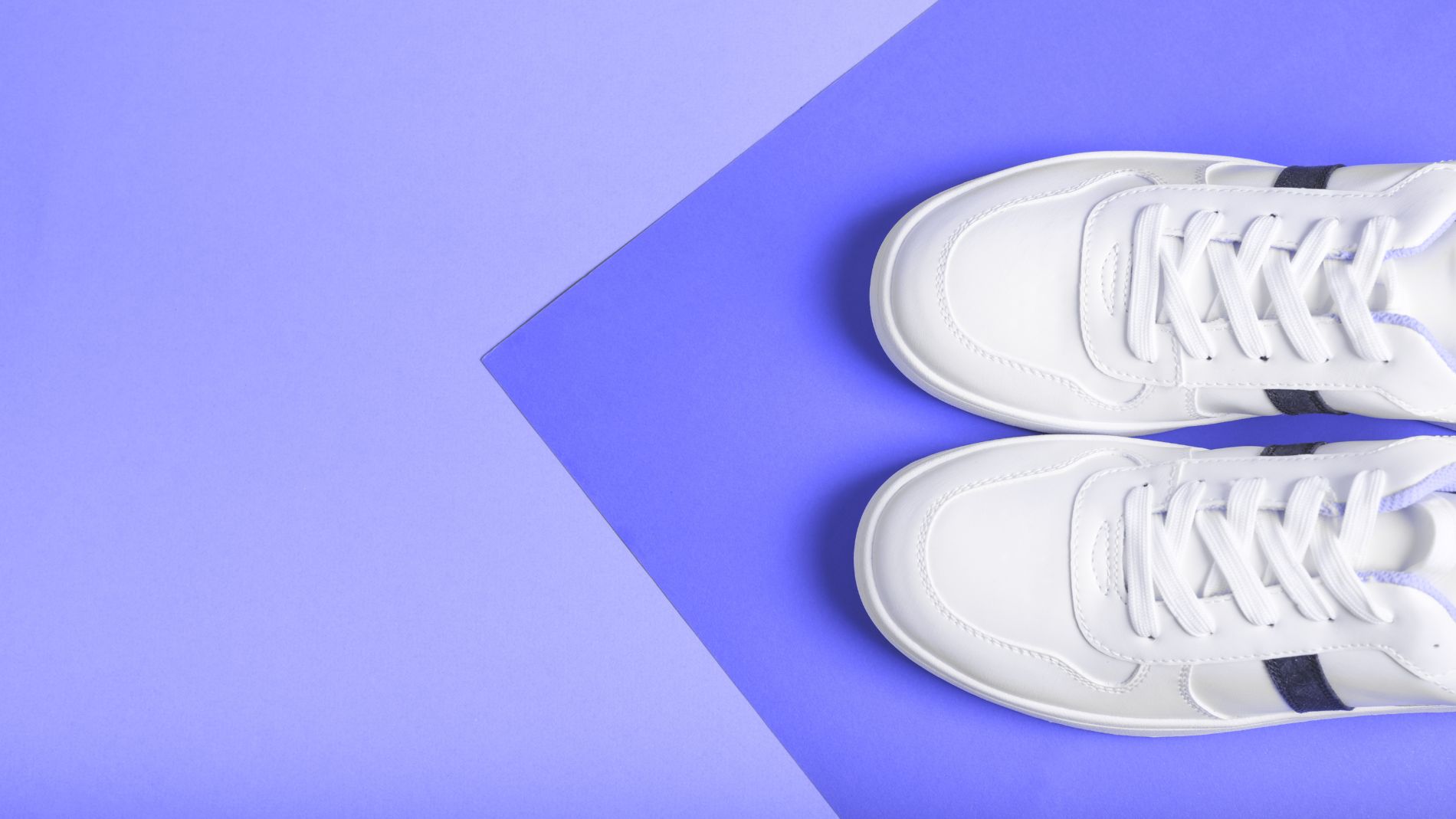 White trainers on coloured background