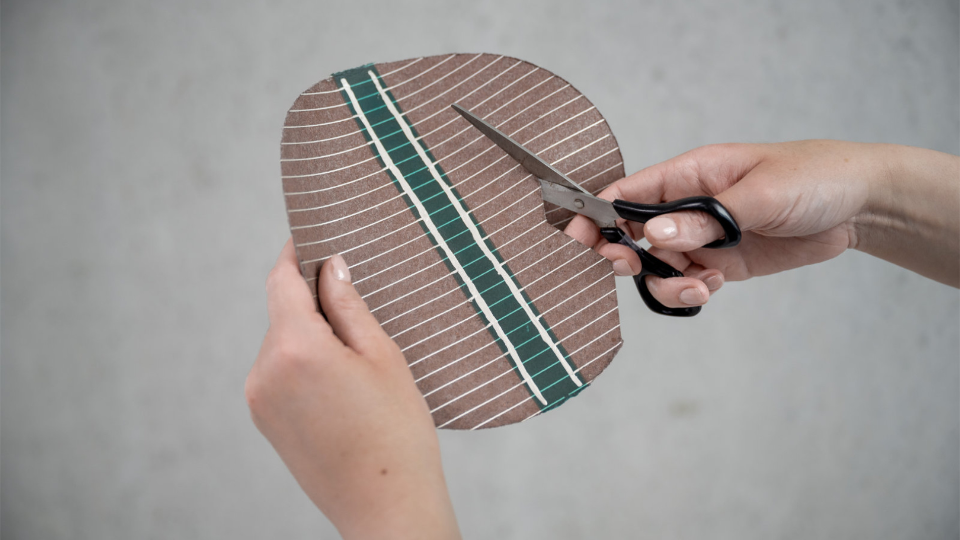 Flexible solar film cut with scissors