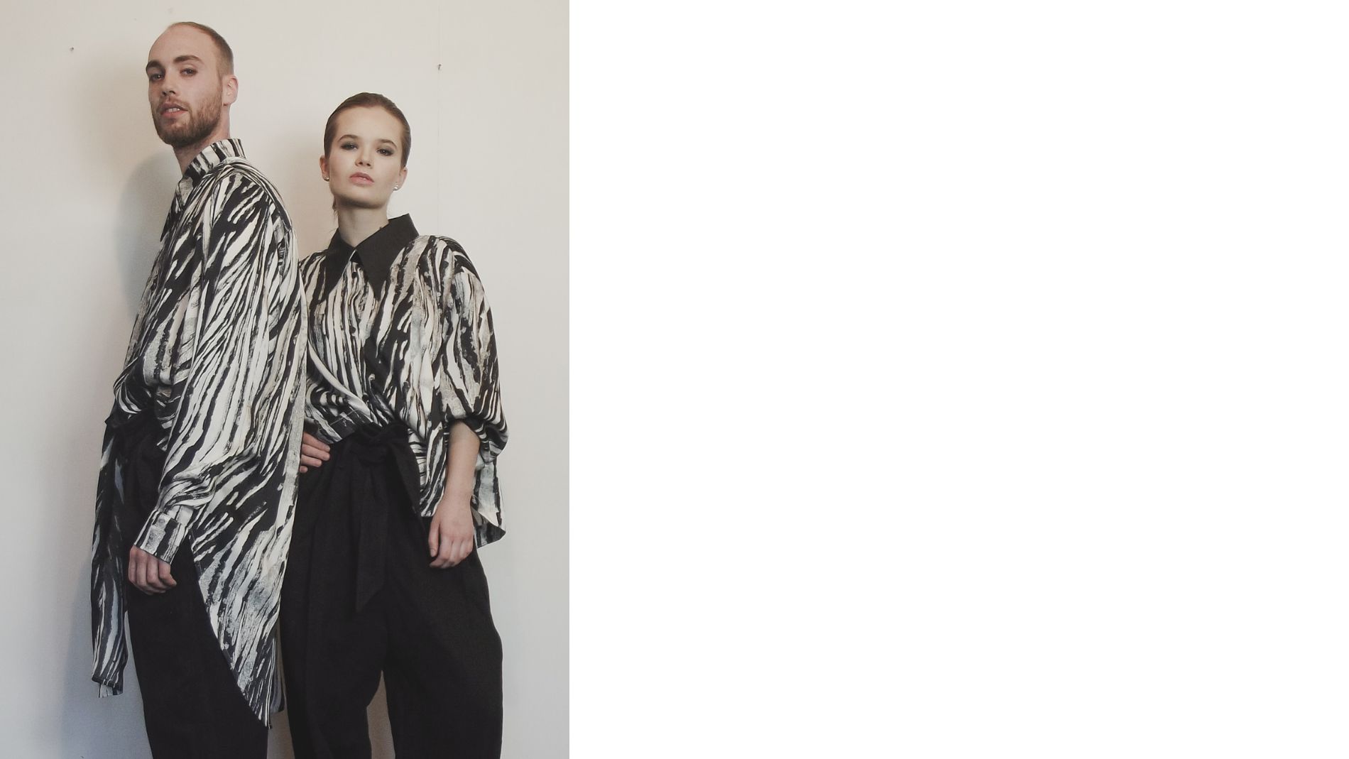 Two models wearing graphic patterned fashion