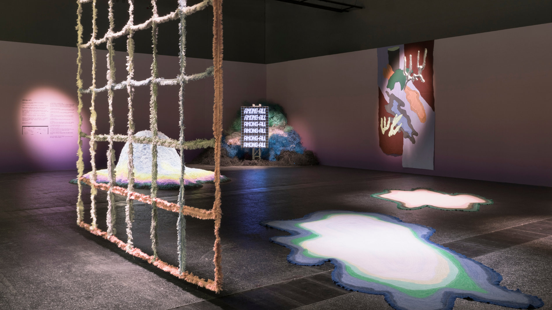 Textile art exhibition with installations and light surfaces