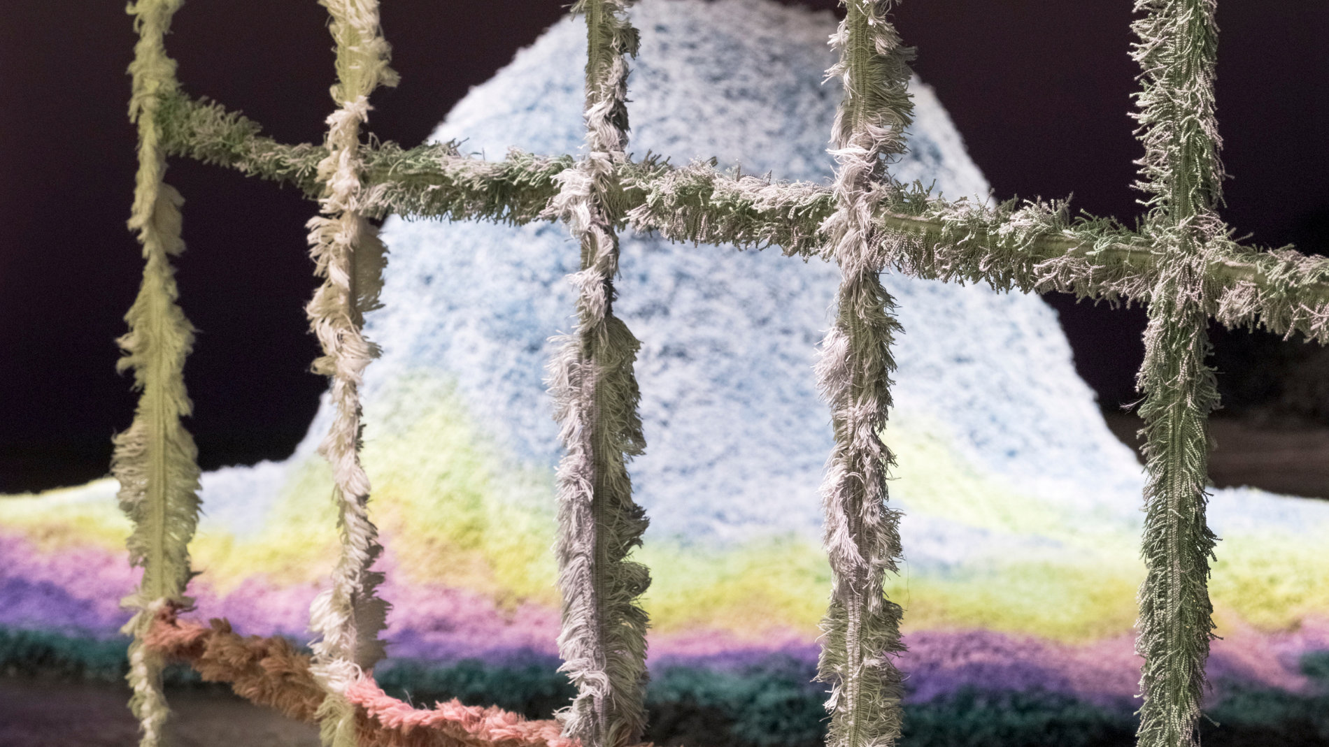 Detailed view of a textile grid in an exhibition